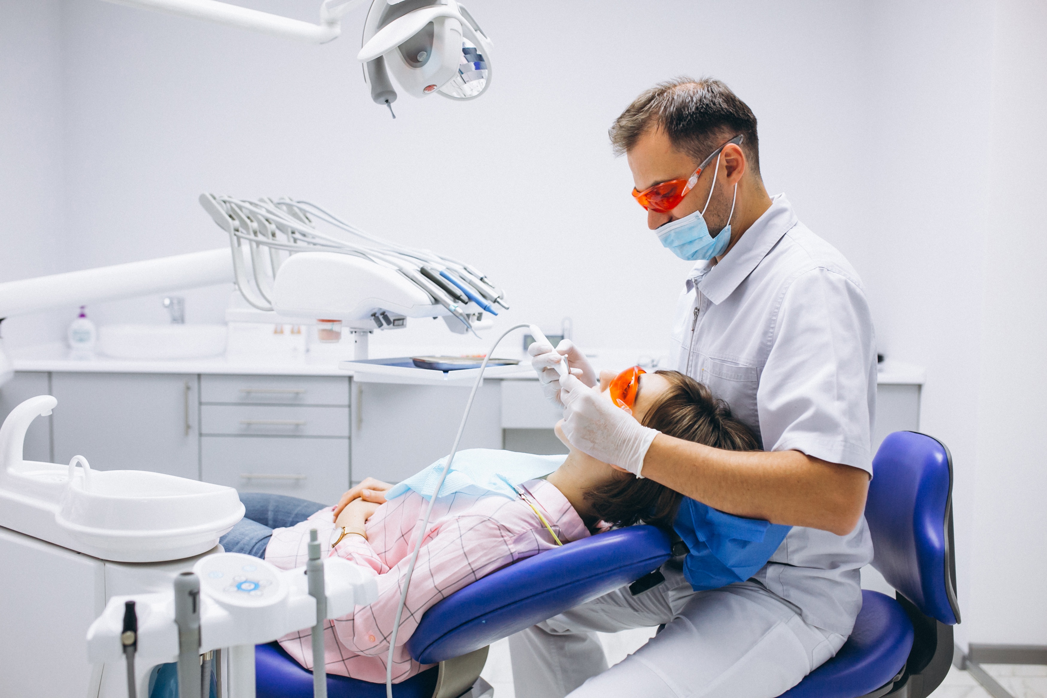 Dentist providing treatment at Doctors Dental Care